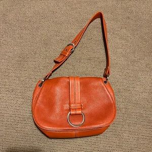 Cole Haan orange purse.